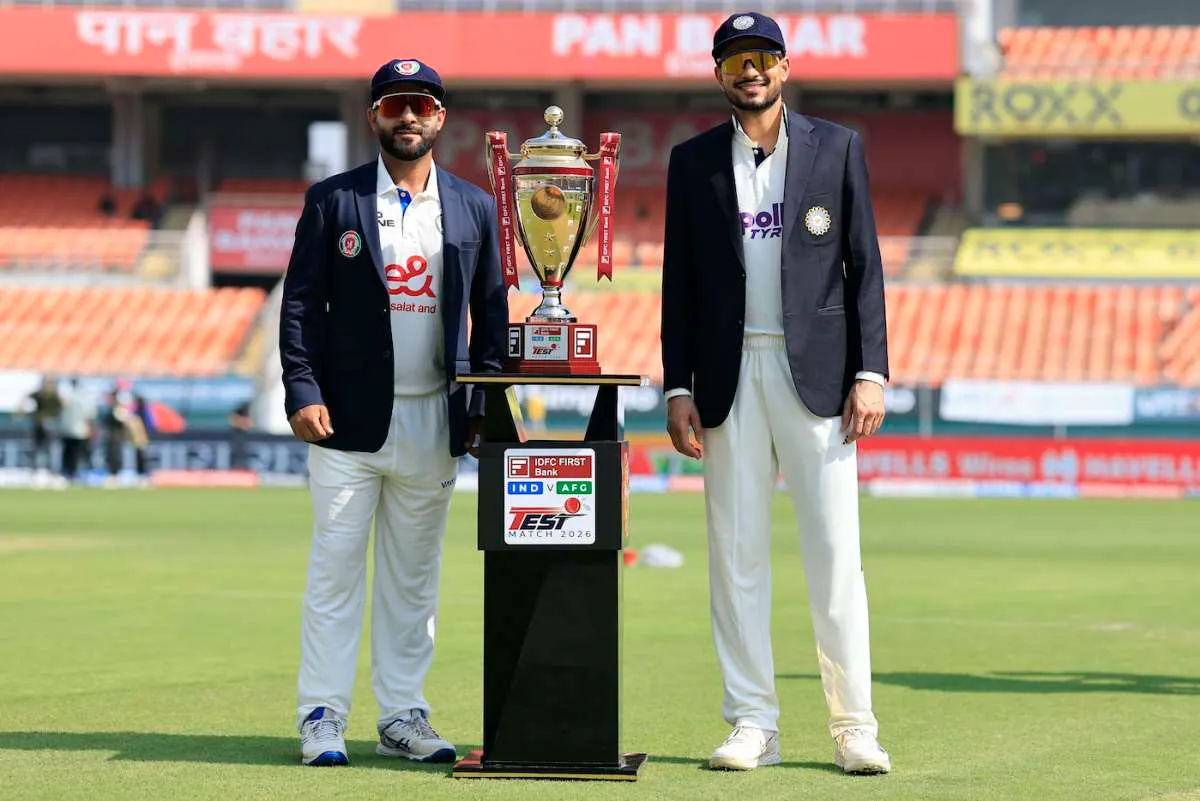 Hashmatullah Shahidi and Shubman Gill pose with the Test trophy before the Mullanpur Test in 2026